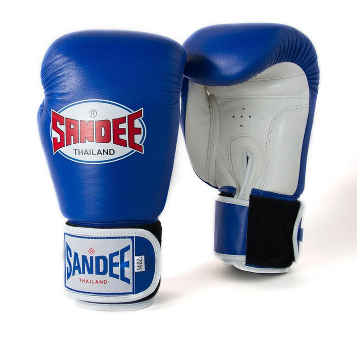 A pair of blue and white Velcro boxing gloves with the brand name 'SANDEE' on them.